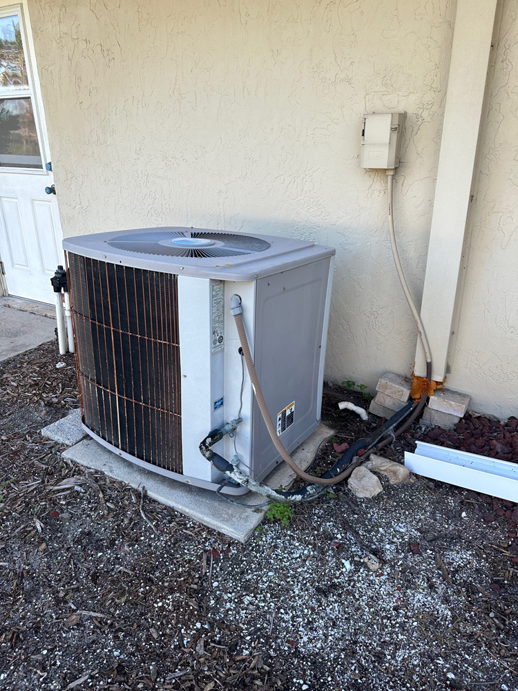 Air conditioning unit on ground outside of home in East Orlando, Florida
